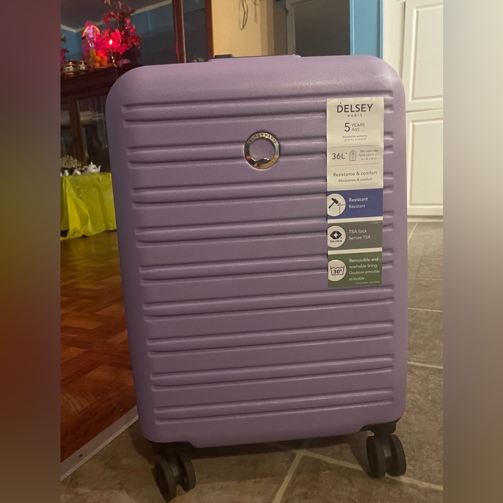 Delsey carry on suitcase in lilac